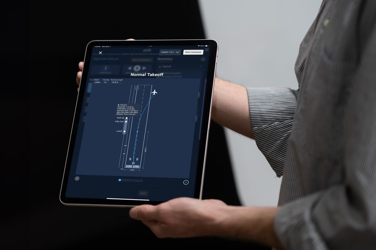 A person using an AI-powered debriefing station on a tablet to review a flight takeoff simulation.