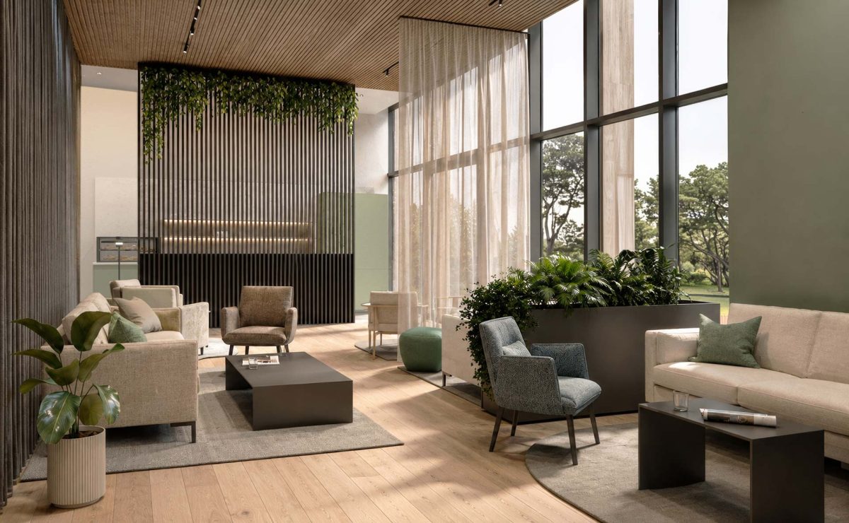 Contemporary lounge area with comfortable seating, indoor plants, floor-to-ceiling windows, and warm wood finishes, creating a bright and welcoming atmosphere.