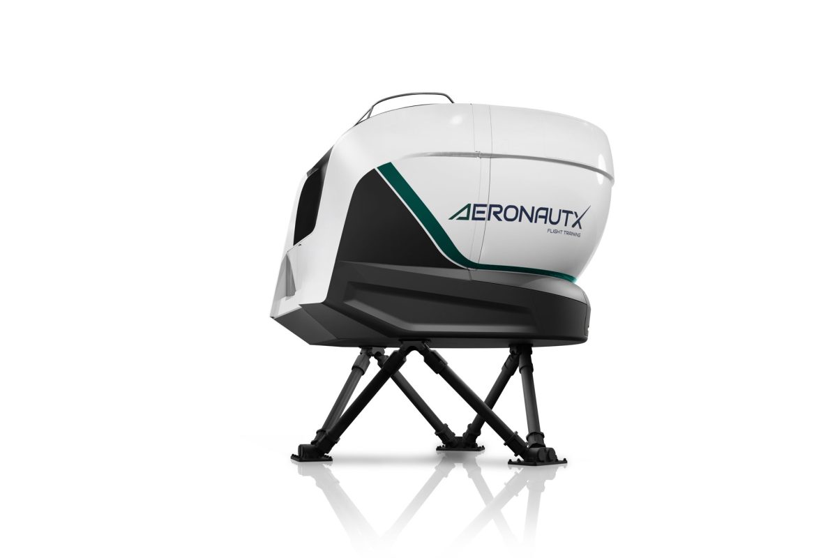 Model of an advanced full-flight simulator. The white simulator cabin with green AeronautX branding is mounted on a full-motion platform with hydraulic actuators.